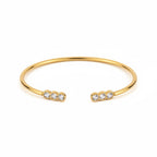 ALIÉA Aurelia armbånd i 18K guldbelagt stål med fine zirkonia-sten i åbent design