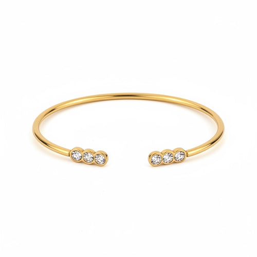 ALIÉA Aurelia armbånd i 18K guldbelagt stål med fine zirkonia-sten i åbent design